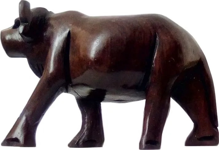 wooden carving sculpture of bull